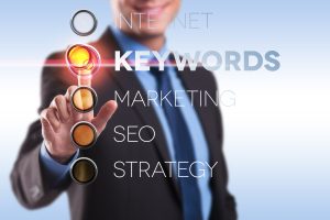 business man choosing the keywords option on a digital screen business man choosing the keywords option on a digital screen
